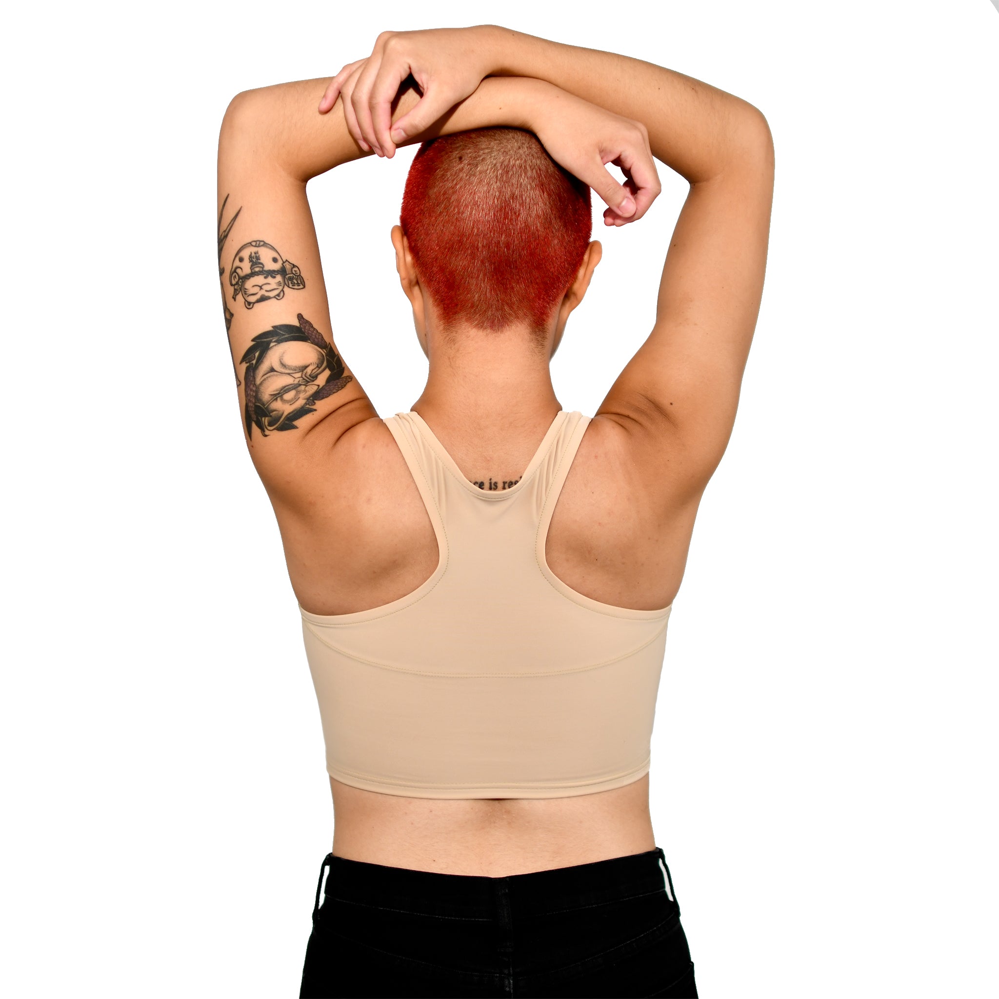 Model shows off a Nude No. 4 racerback binder, back to the viewer with arms resting atop the head.