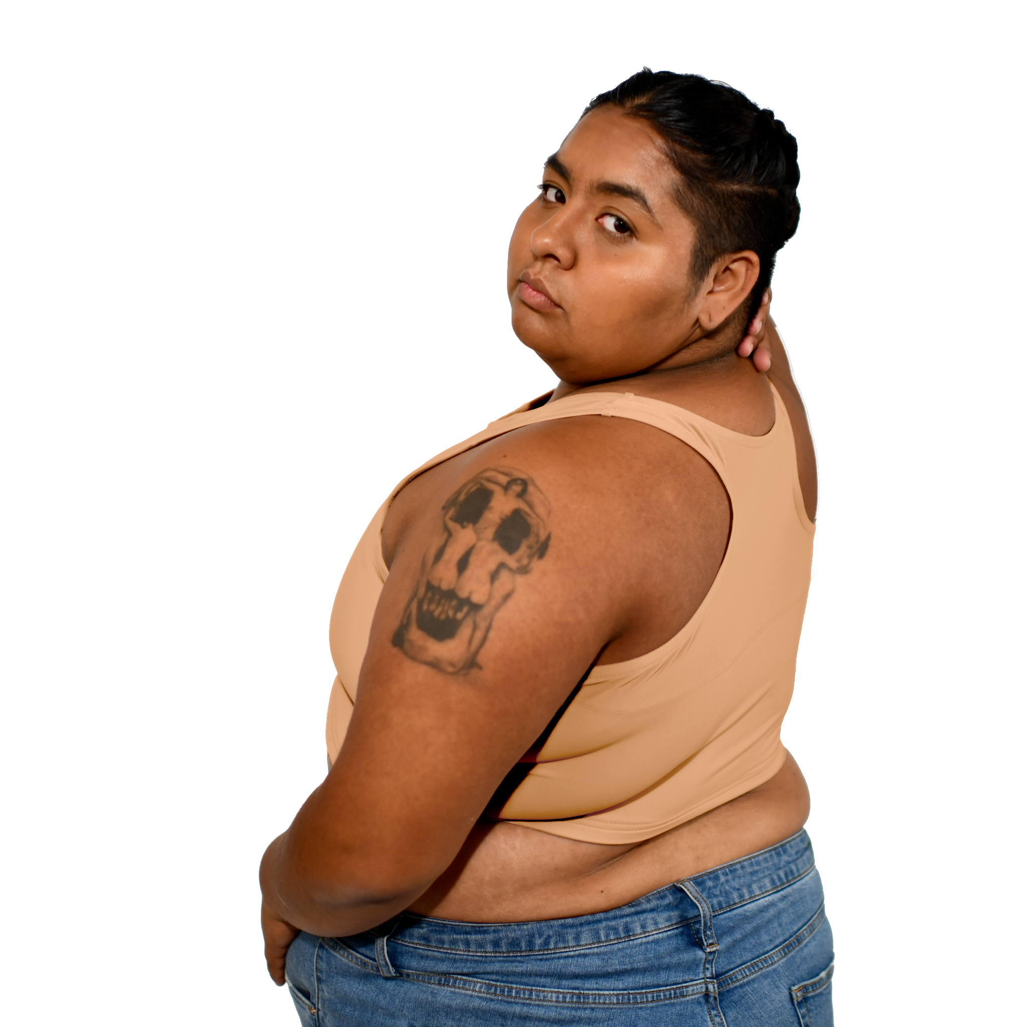 Model shows off a Nude No. 3 racerback binder, back to the viewer, looking over the shoulder.