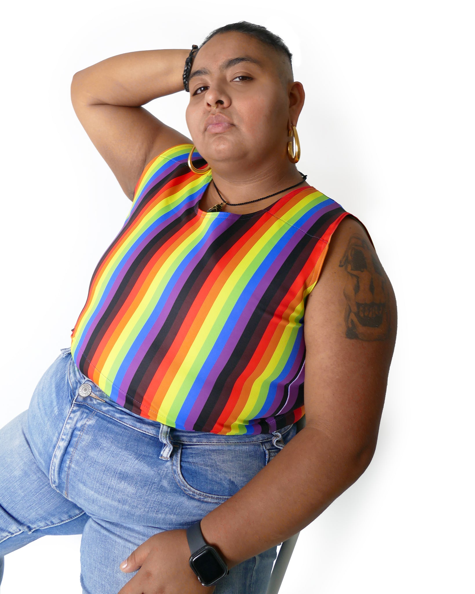 Person wearing More Color More Pride Binder, with Rainbow, Black and Brown vertical stripes.